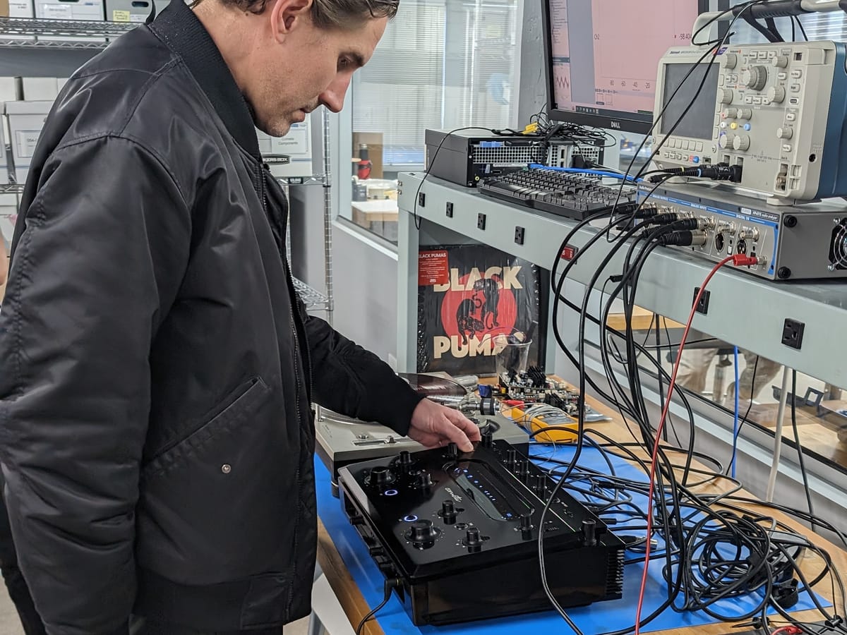Engineer running acoustic tests on a device at the Expertise Engineering lab