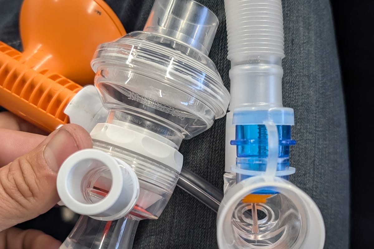 Respiratory device valve and filter components