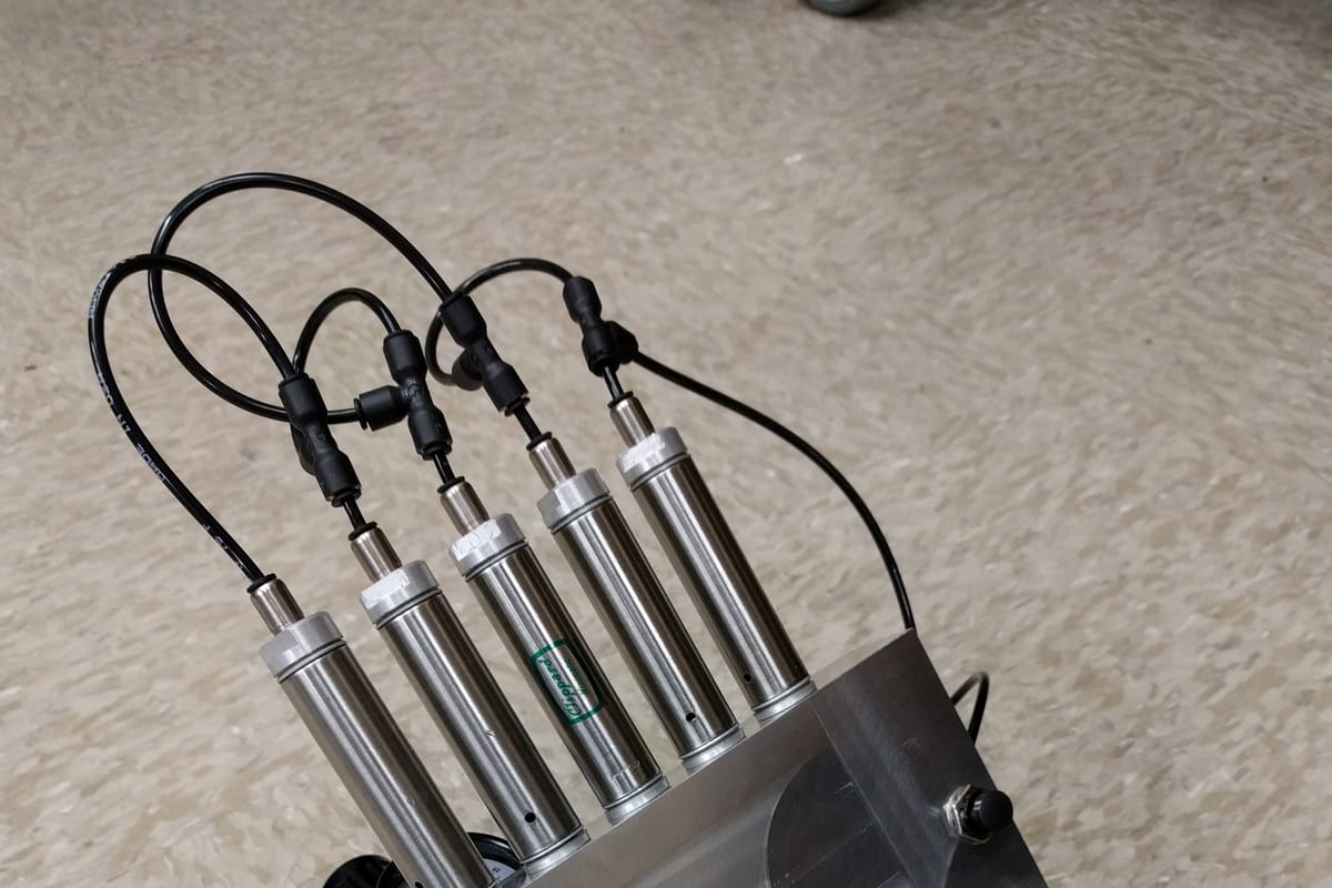 Machined aluminum pneumatic test manifold with cylinders